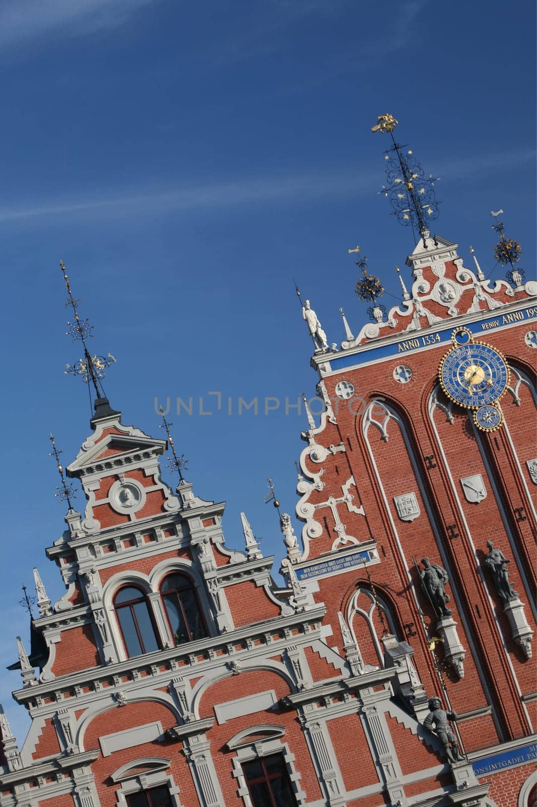 The St. Peter's Church and the Black House in the Old Town of Riga,the main city of Latvia in the BalticS in Eastern Europe.