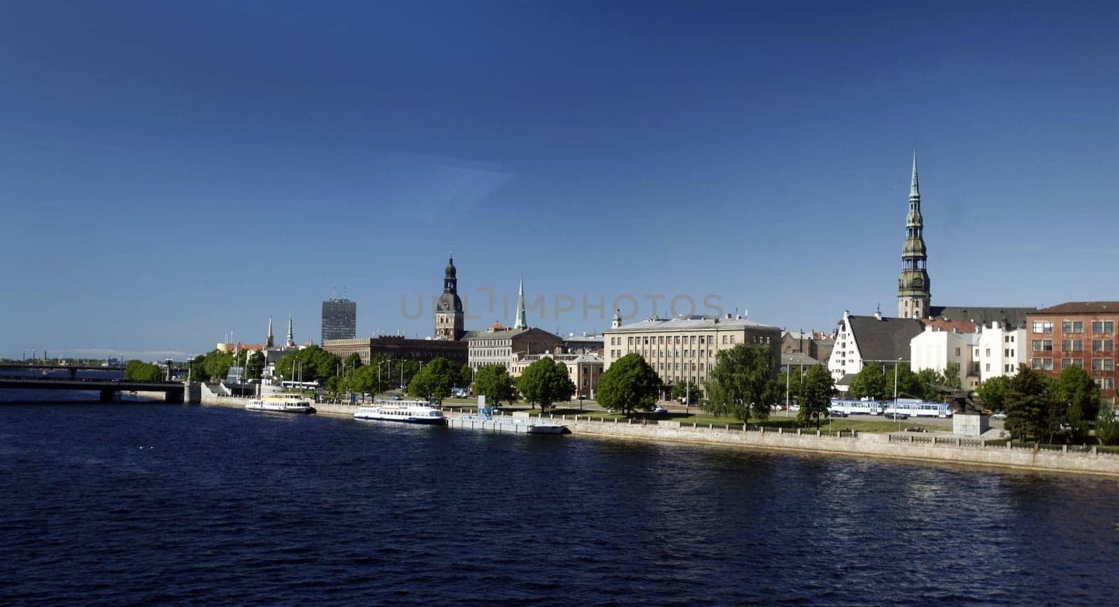 The St. Peter's Church and the Daugava River in the Old Town of Riga,the main city of Latvia in the Baltics in Eastern Europe.