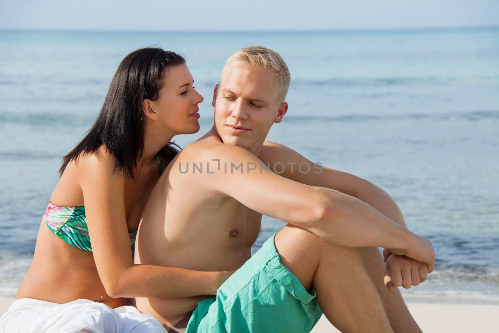 young happy couple in love on the beach in summer holidays rest rest holiday sun