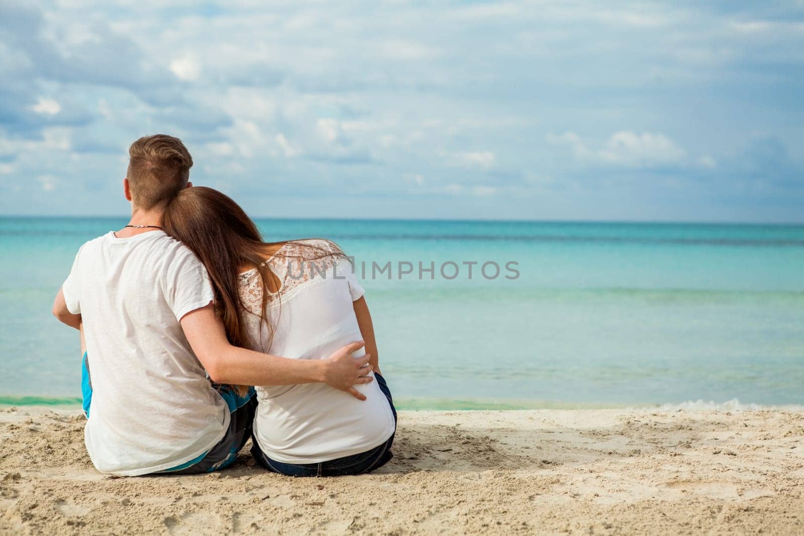 young happy couple in love on the beach in summer holidays rest rest holiday sun