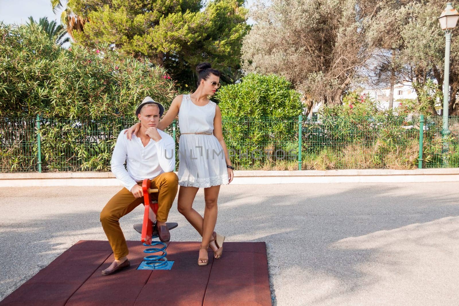 young elegant couple with fashionable clothes in summer leisure park outdoors