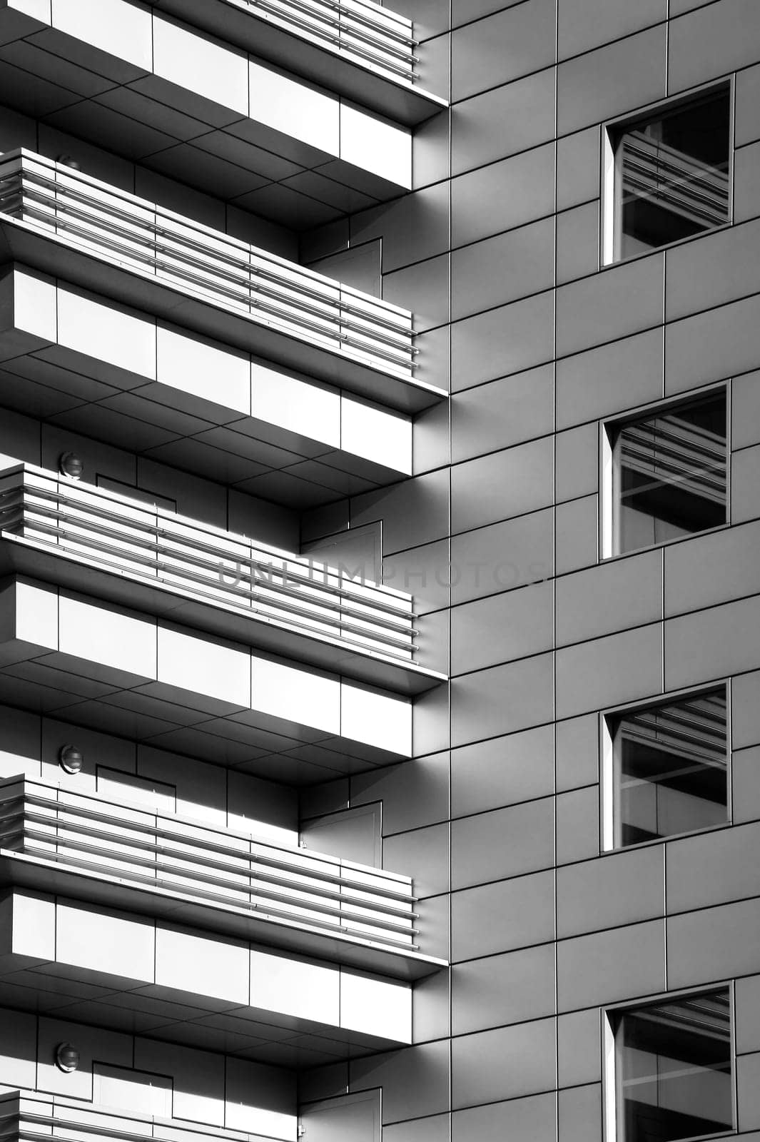 Photographing modern balconies on a high-rise building.