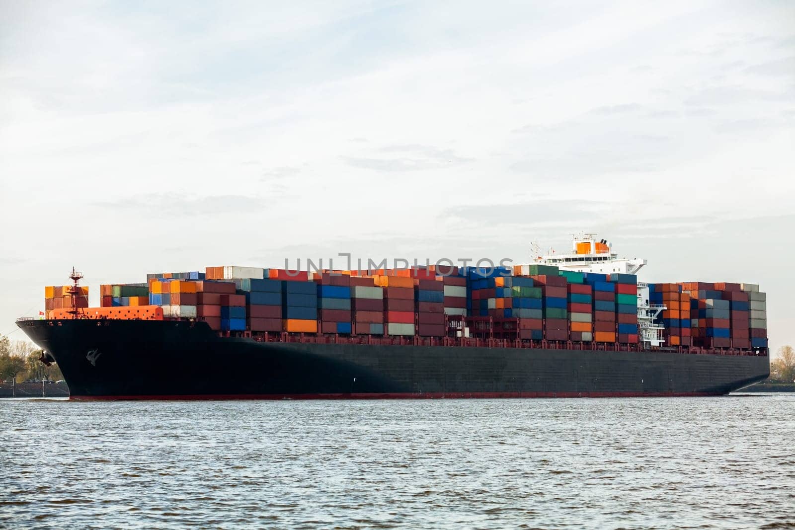 fully loaded cargo ship with containers on the water-contaminated ship trade transport