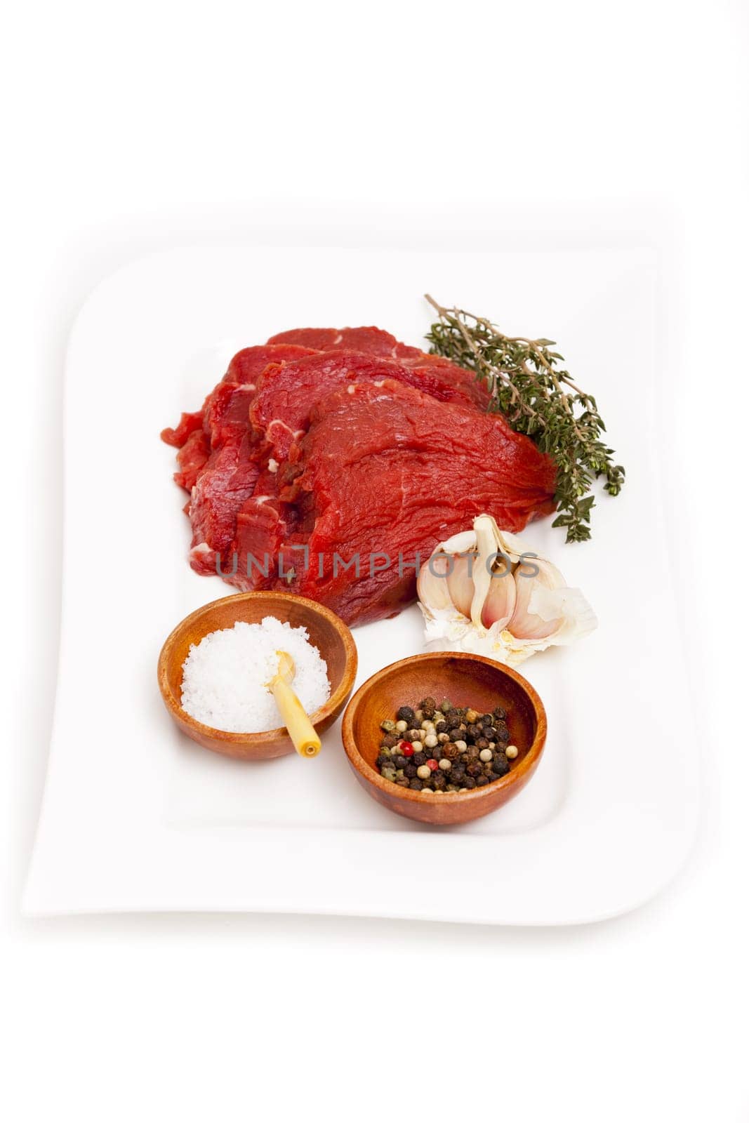 Beef fillet with herbs and spices on plate