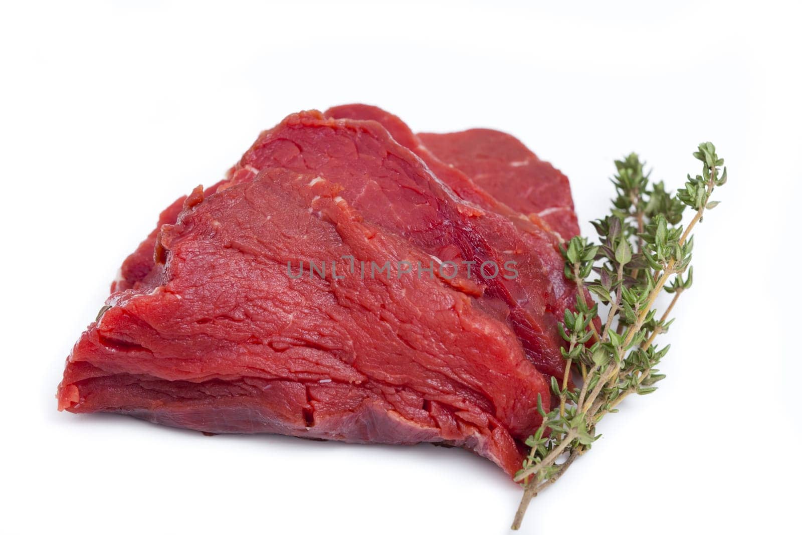 Piece of tender beef fillet with thyme branch