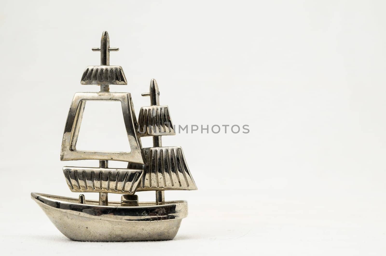 Metal Sailing Boat Figurine on a white background