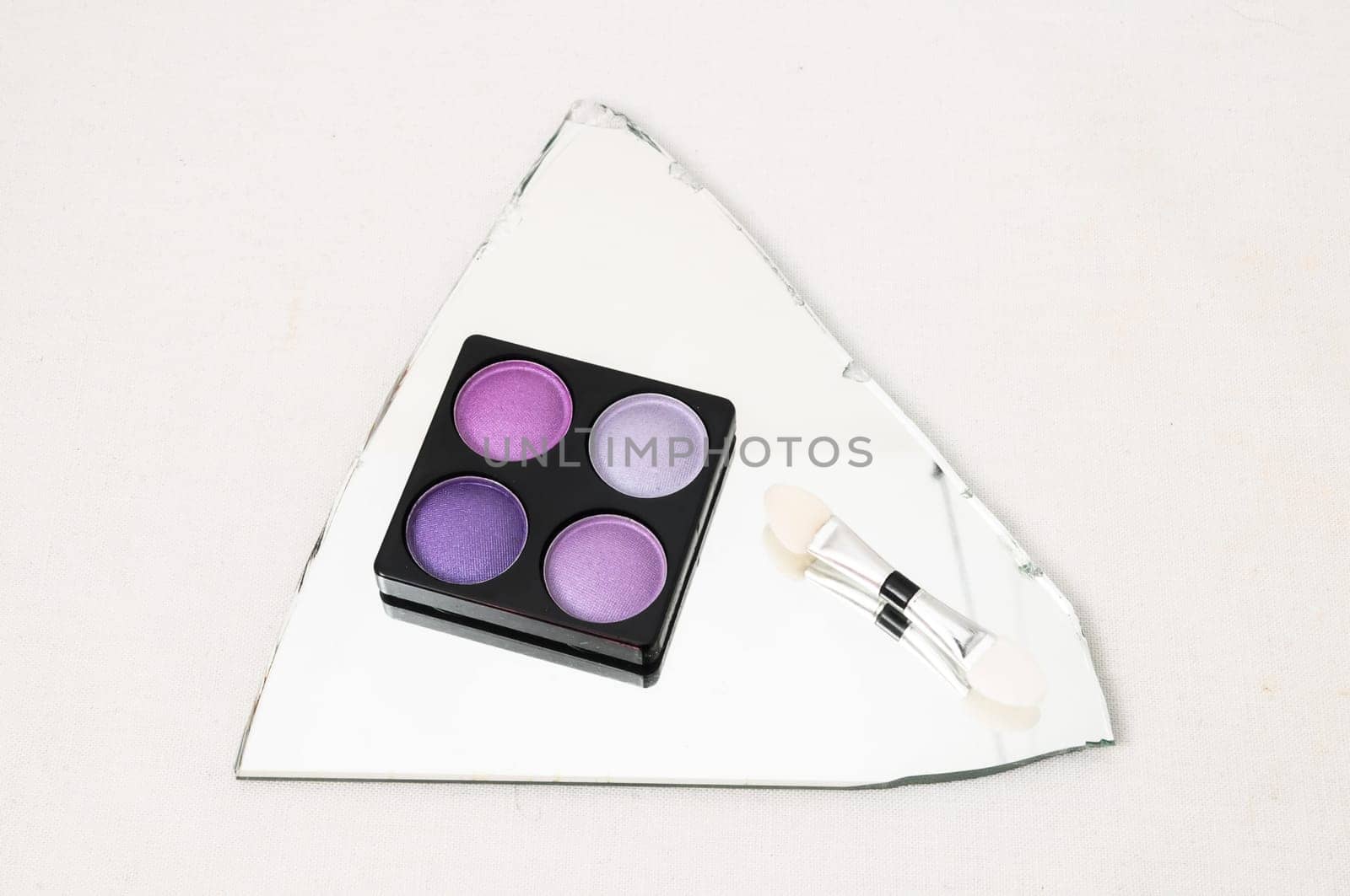 Make-up Palette Of Colorfully Eyeshadows Over White Background