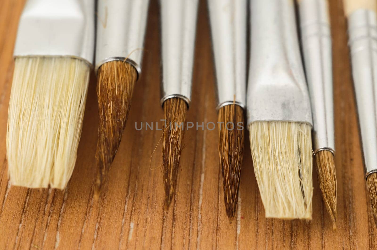 New Wooden Different Paintbrush Set Texture over a Colored Background