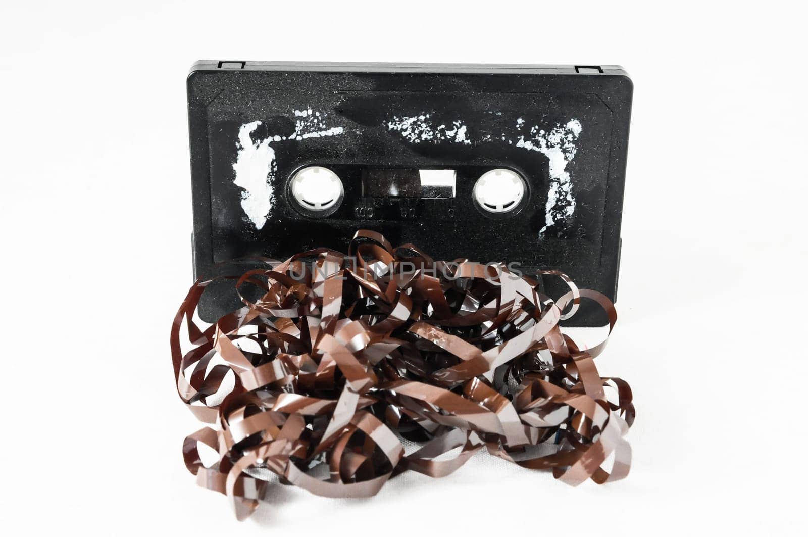 Ancient Vintage Used Musicassette over a White Background