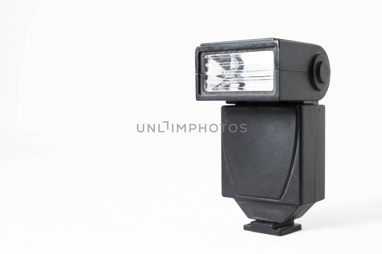 Black Photo Camera Flash on a White Background