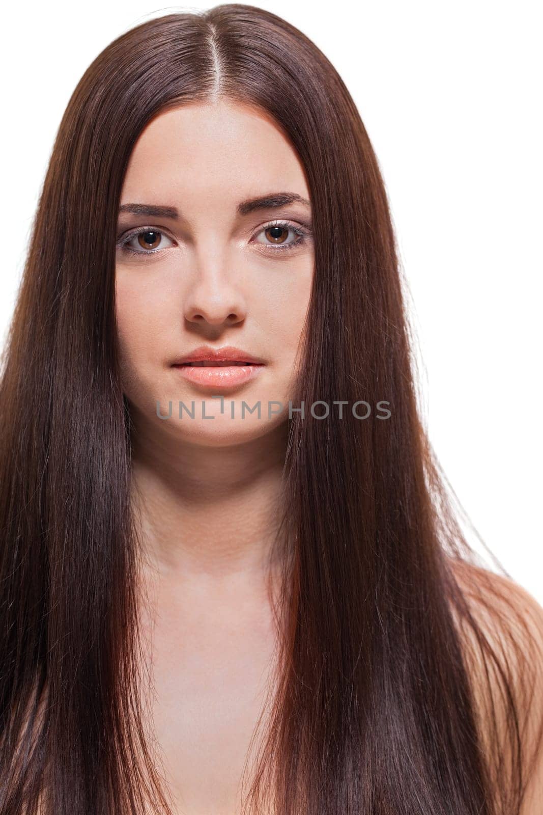 attractive young woman with long dark hair and beautiful healthy skin isolated portrait