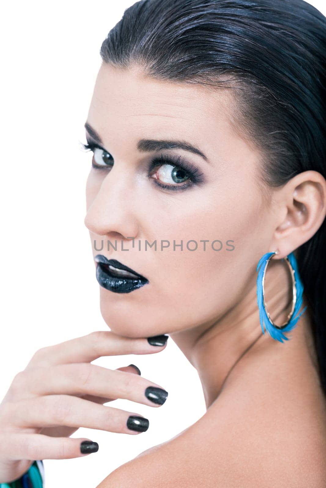 attractive young woman with black hair blue eyes and black makeup lips nail polish portrait