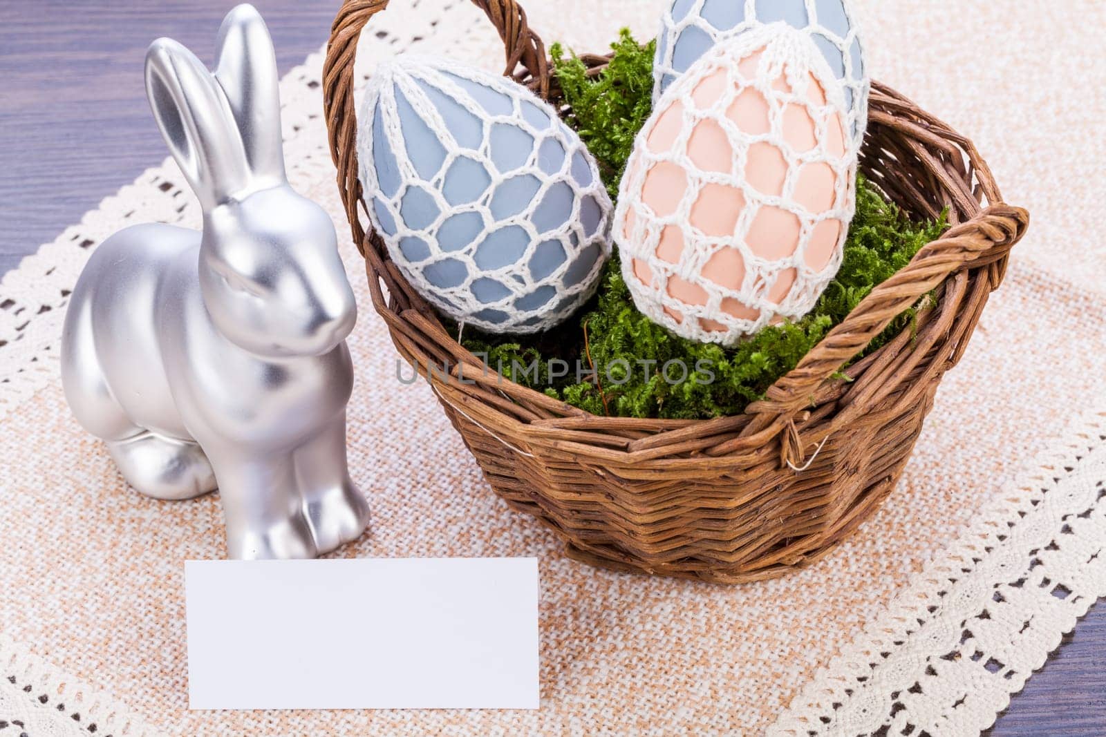 Colourful yellow and red Tulip with Easter eggs decorated at Easter with text space on green background