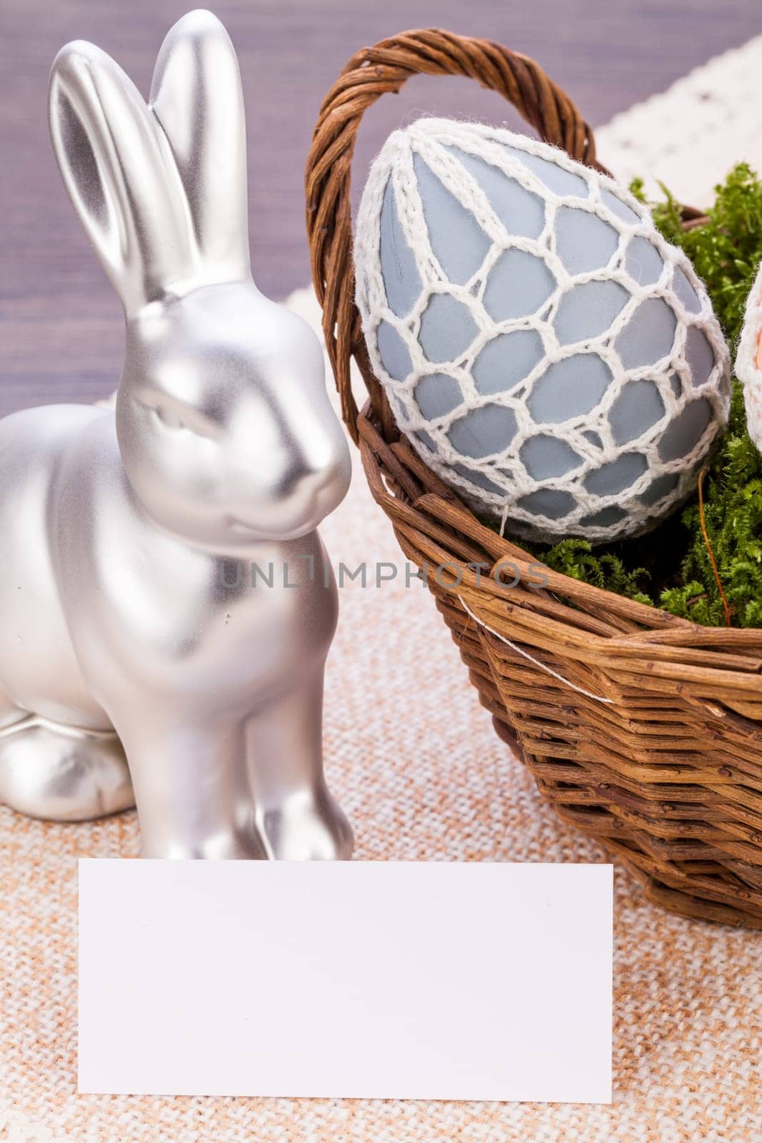 Colourful yellow and red Tulip with Easter eggs decorated at Easter with text space on green background