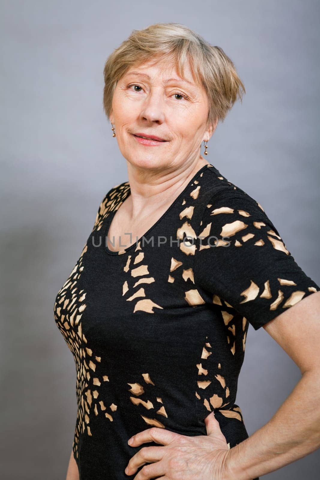 older adult woman seniorwith grey hair and wrinkle swelling healthy portrait in front of gauem background