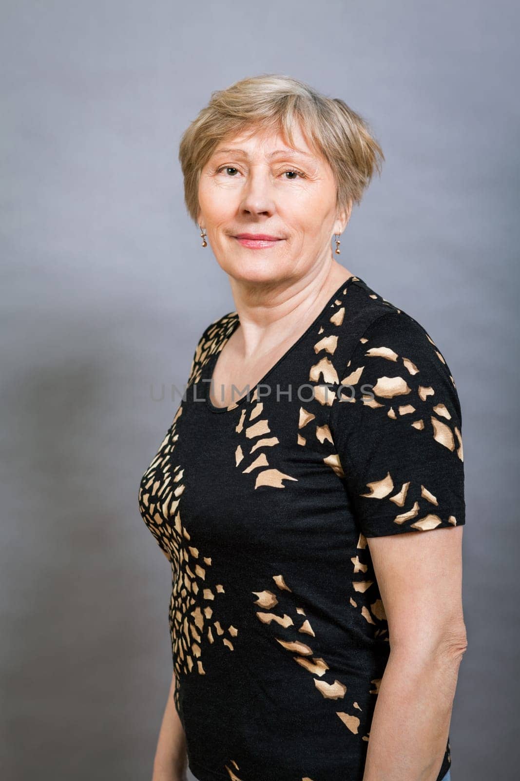 older adult woman seniorwith grey hair and wrinkle swelling healthy portrait in front of gauem background
