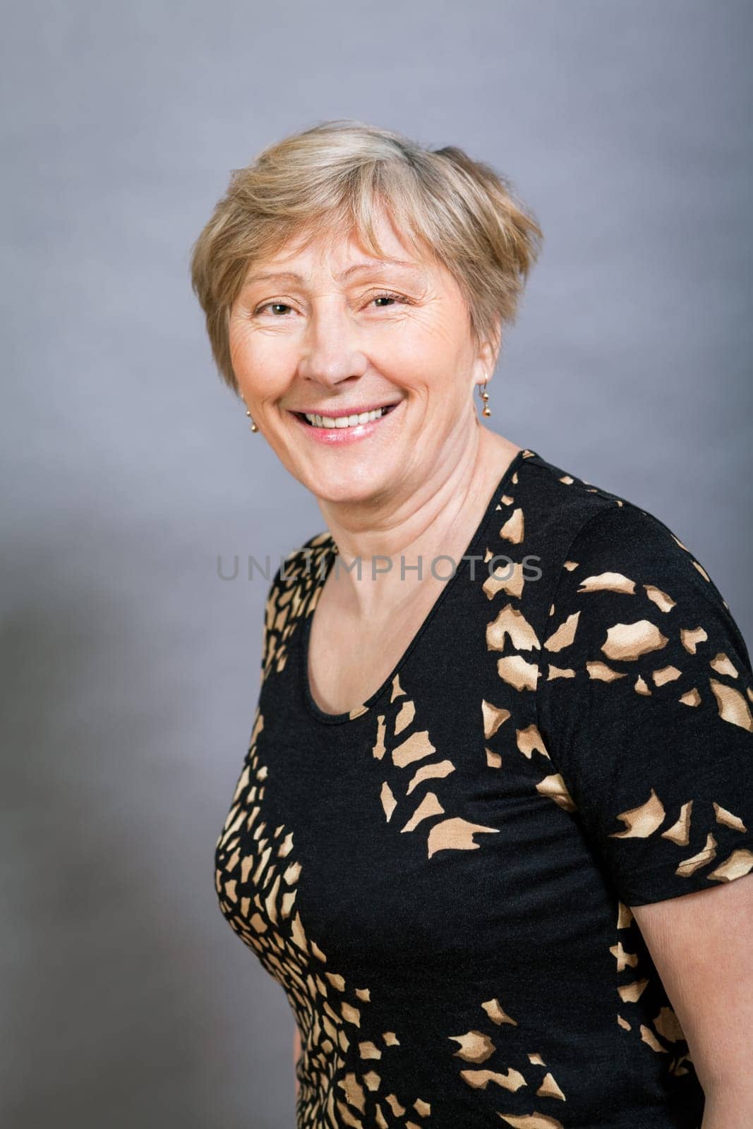 older adult woman seniorwith grey hair and wrinkle swelling healthy portrait in front of gauem background