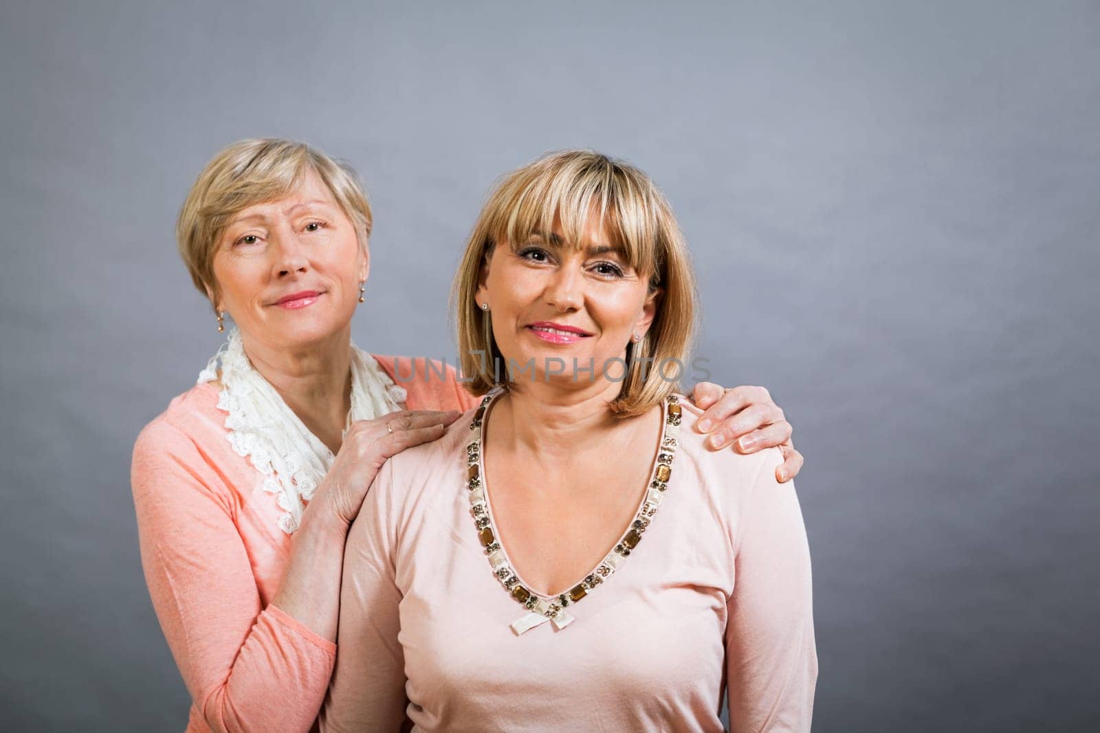 older adult happy wife mother with adult daughter portrait generation against grey background