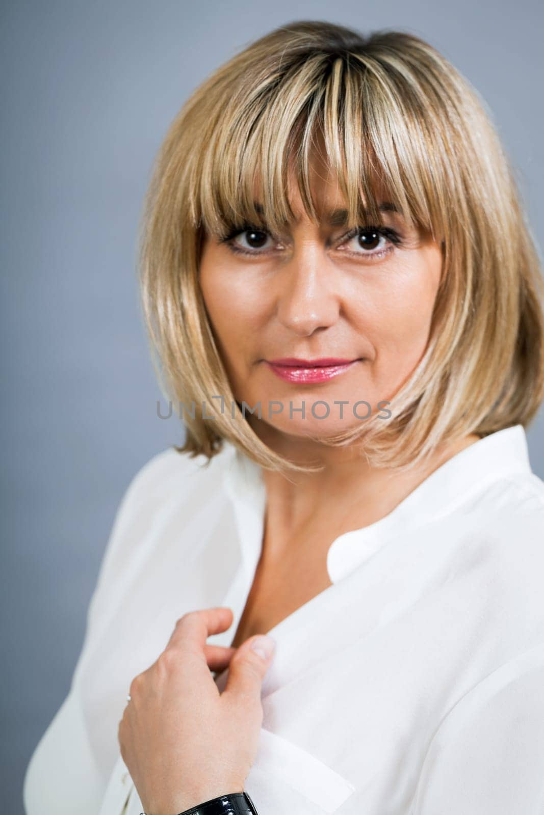 adult attractive woman in middle age portrait against gauem background