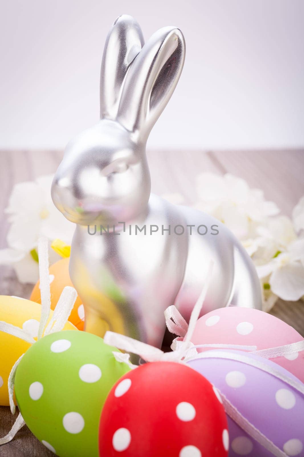 Colourful yellow and red Tulip with Easter eggs decorated at Easter with text space on green background