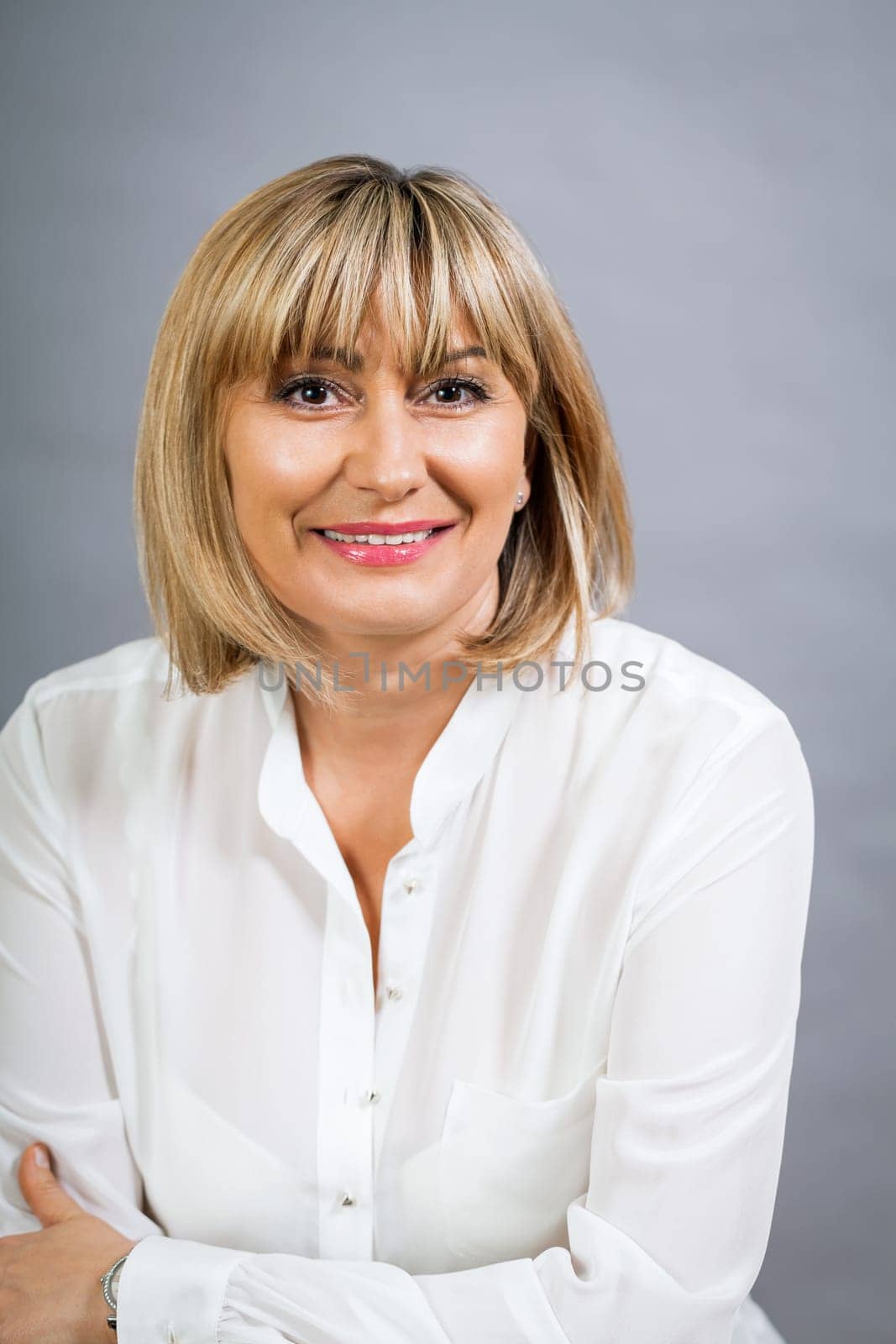 adult attractive woman in middle age portrait against gauem background
