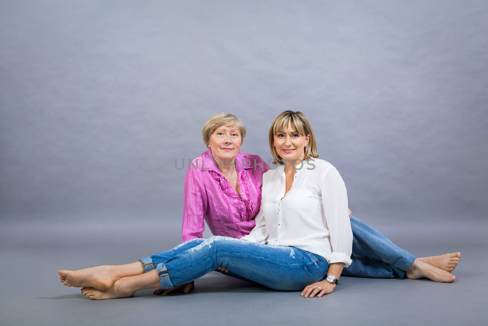 older adult happy wife mother with adult daughter portrait generation against grey background
