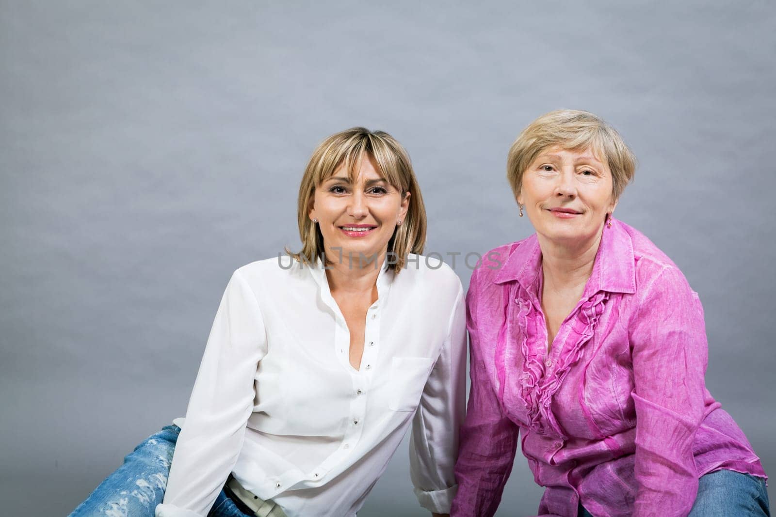 older adult happy wife mother with adult daughter portrait generation against grey background