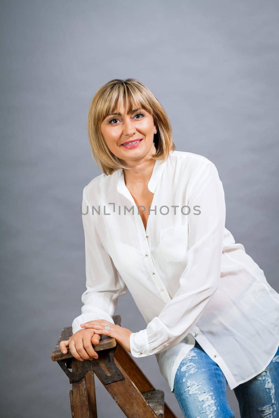 adult attractive woman in middle age portrait against gauem background