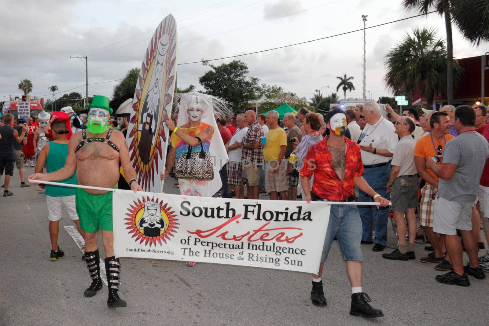 WILTON MANORS, FLORIDA - JUNE 22, 2013: Many South Florida Sisters of Perpetual Indulgence of the House of the Rising Sun marching in the annual gay pride parade on Wilton Drive in the early evening.