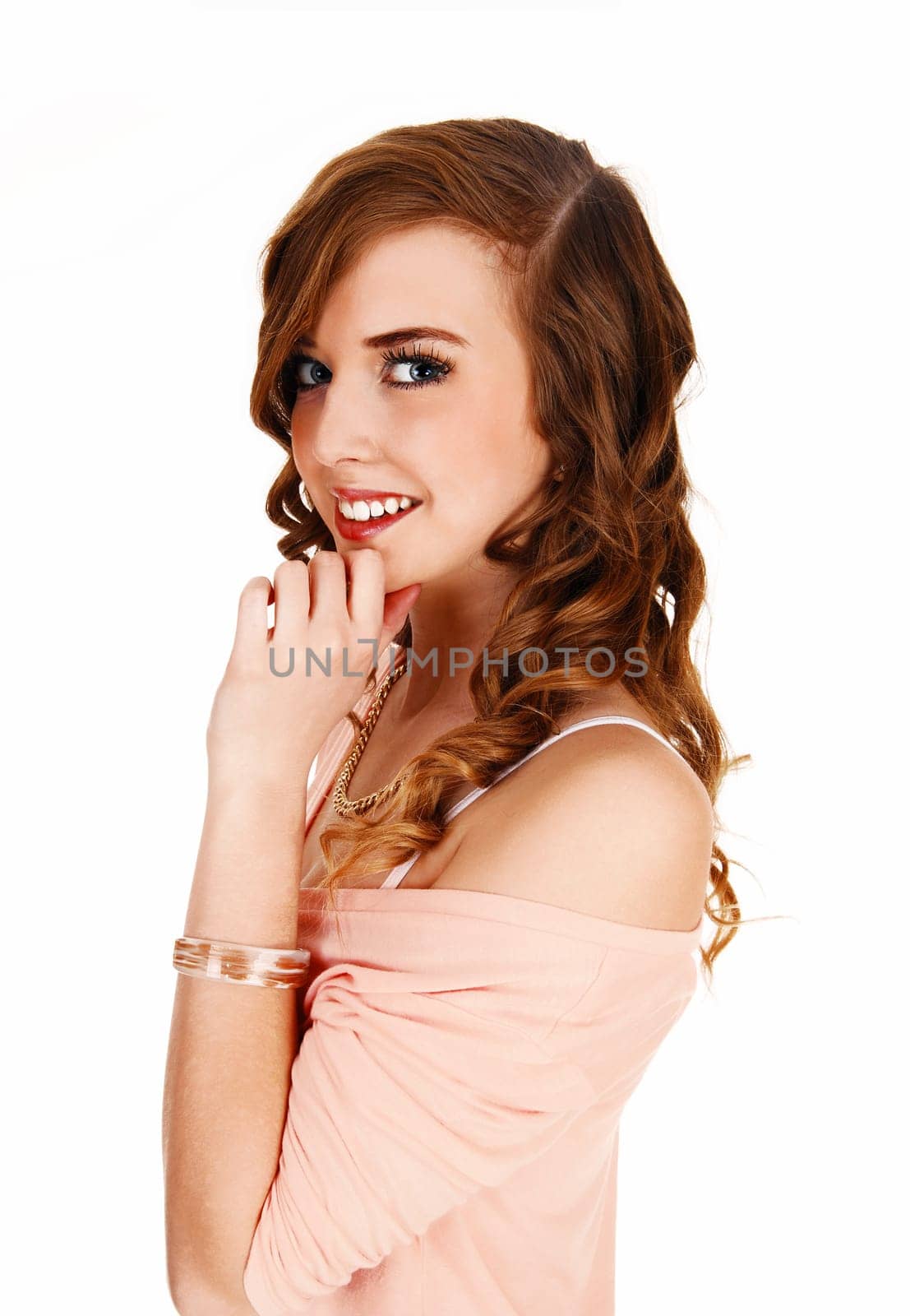 A closeup portrait picture of a young pretty teenager with long curly hair.smiling and blue eyes, for white background..