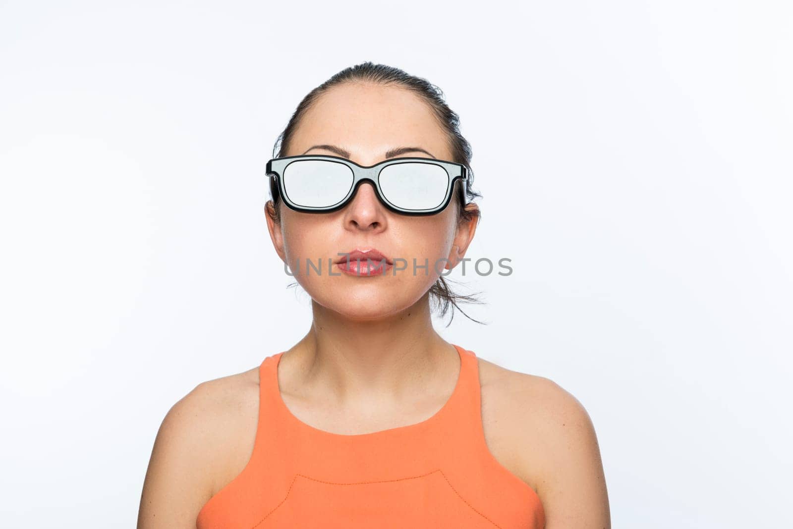 Portrait of beautiful caucasion woman wearing large 3D cinema glasses