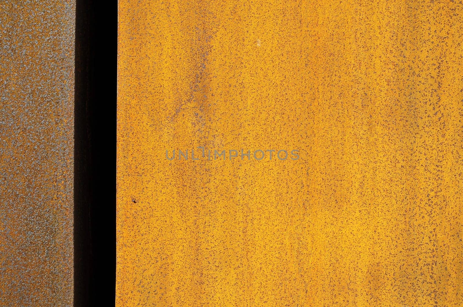 Orange Patterns on Rusty Surface of the Metal