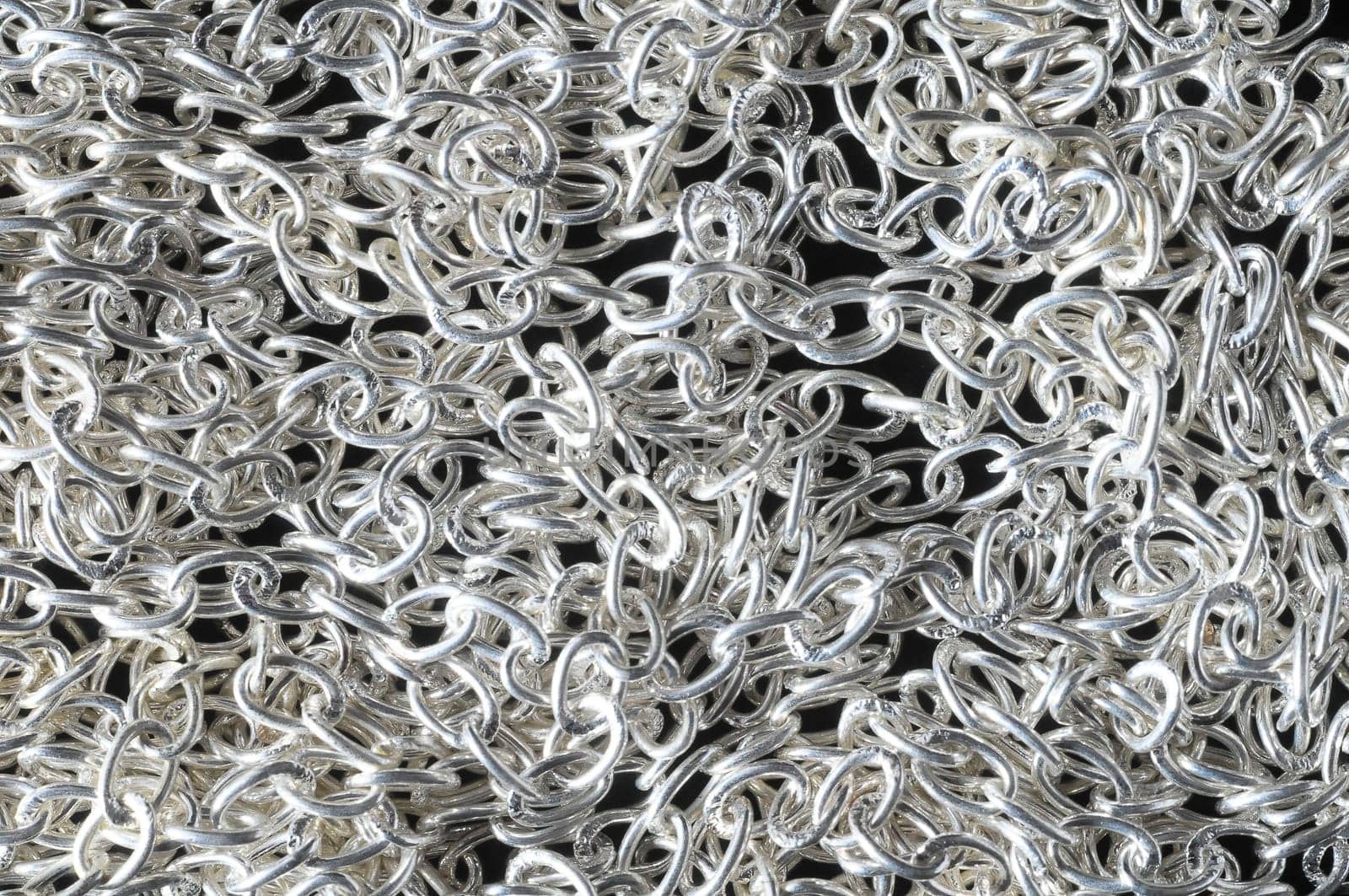 Silver Small Chain Texture on a Black Background