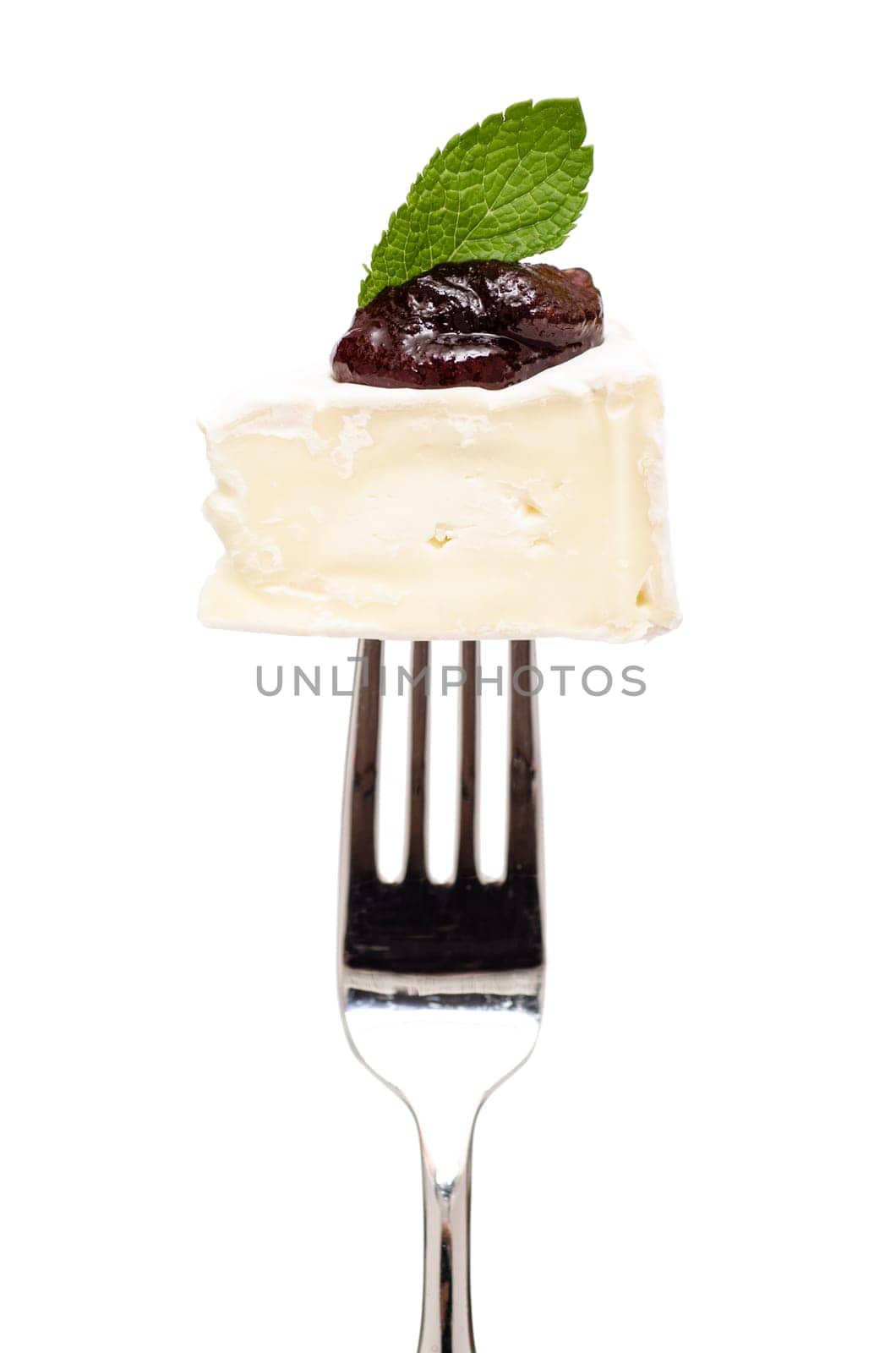 Camembert cheese with fig mustard and a leaf of mint