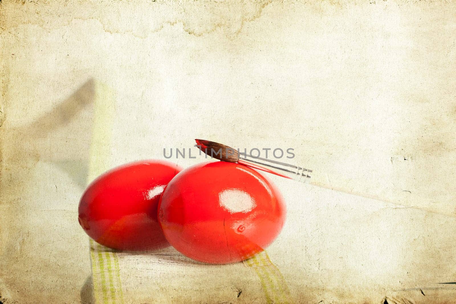 Easter eggs and paint brush on spring bokeh background