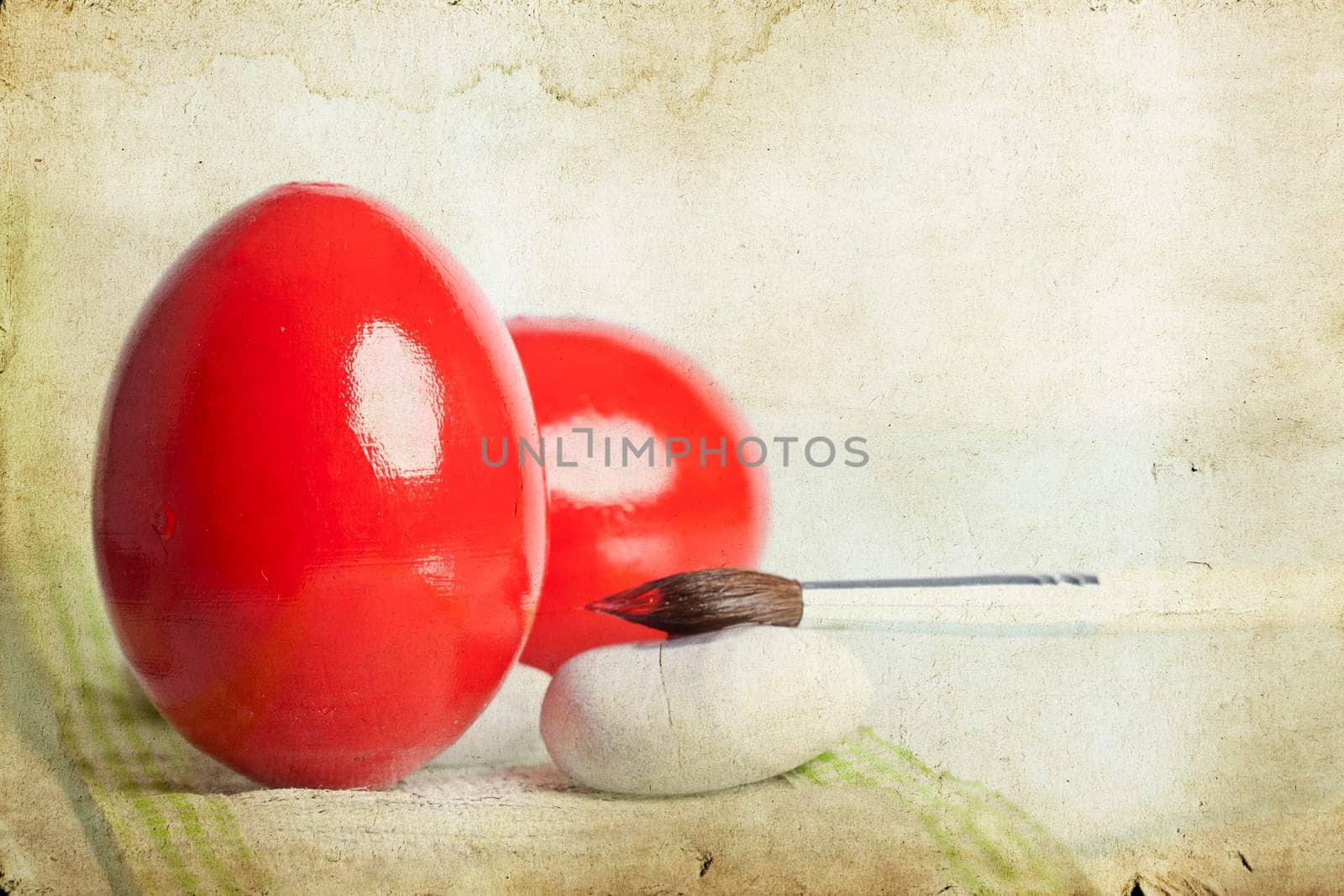 Easter eggs and paint brush on spring bokeh background
