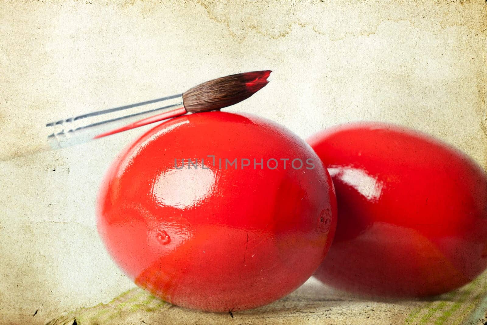 Easter eggs and paint brush on spring bokeh background