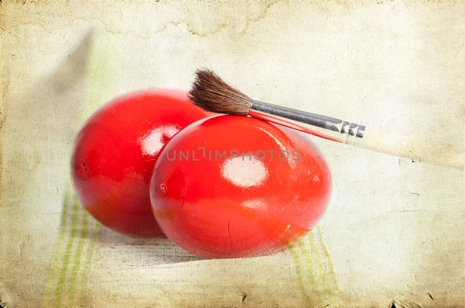 Easter eggs and paint brush on spring bokeh background
