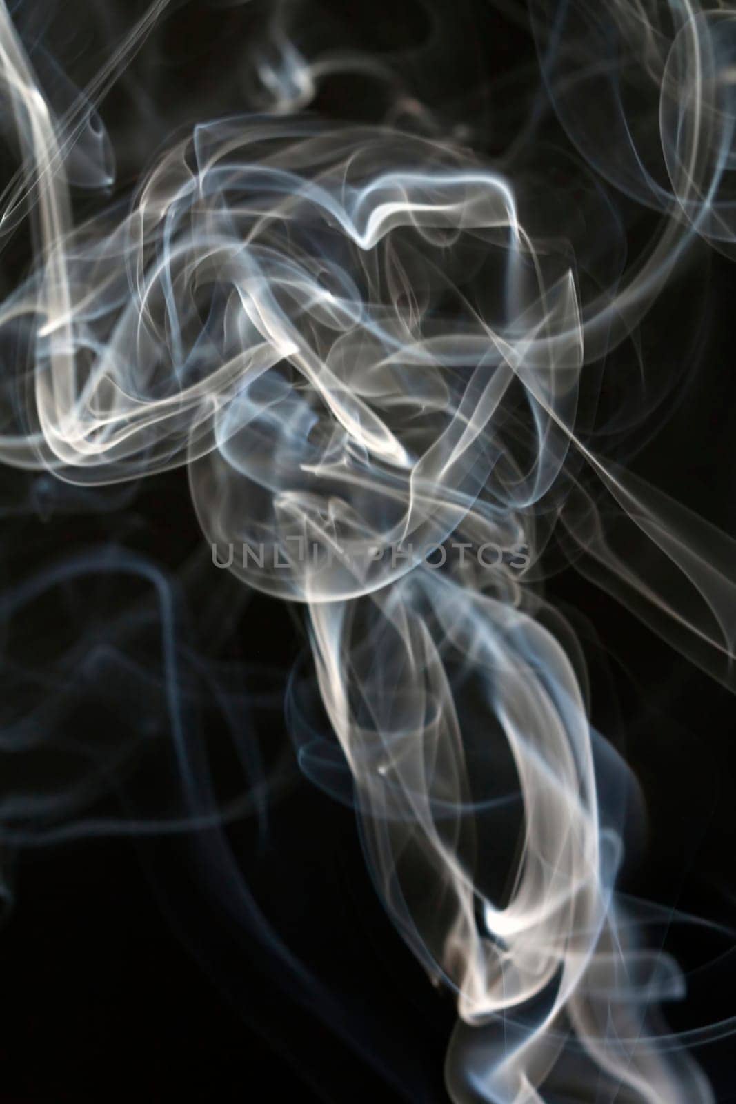 Close up on abstract colored smoke isolated on white background