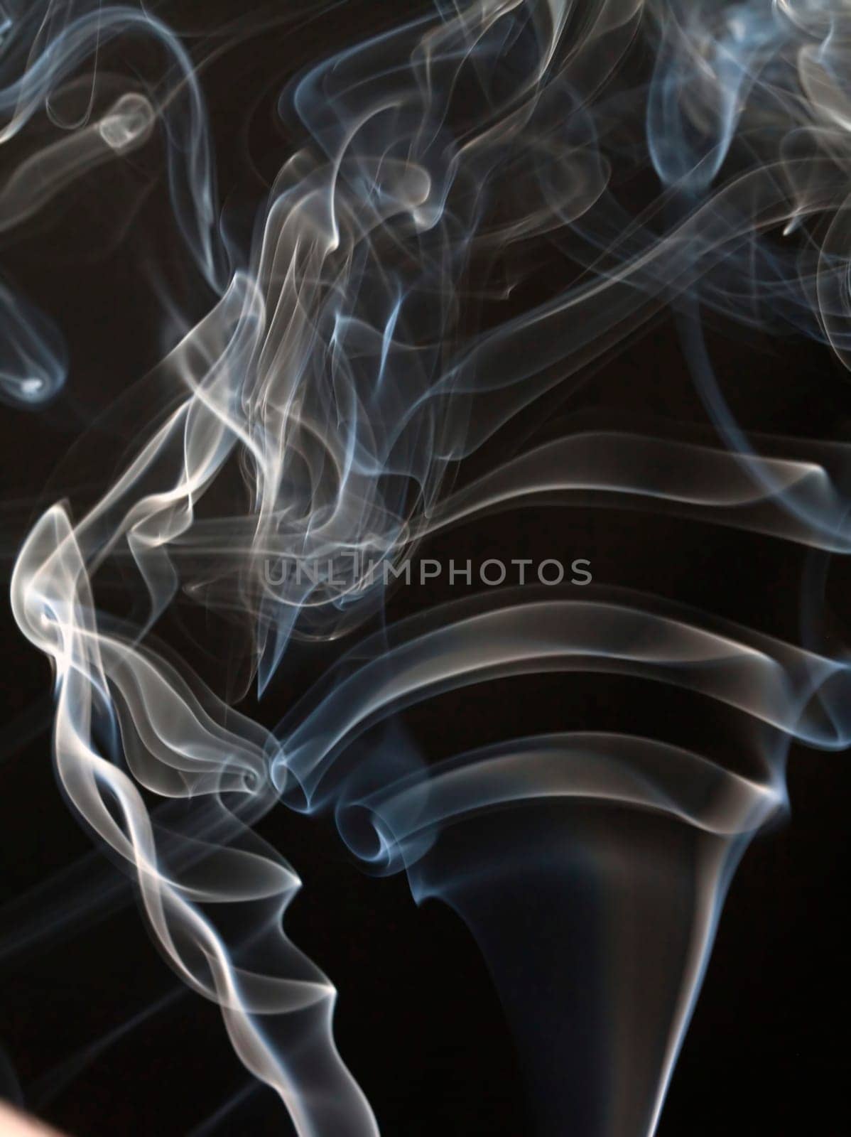 Close up on abstract colored smoke isolated on white background
