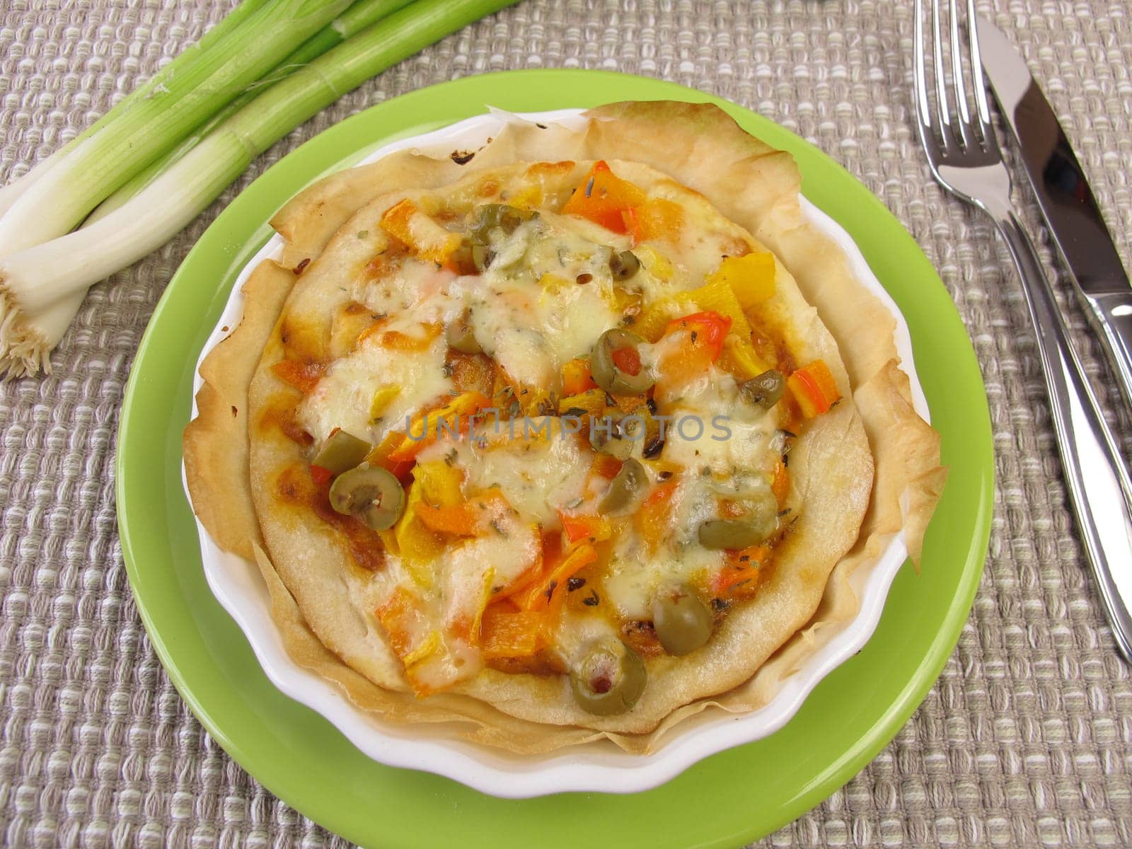 Small quiche with vegetables in a tart form