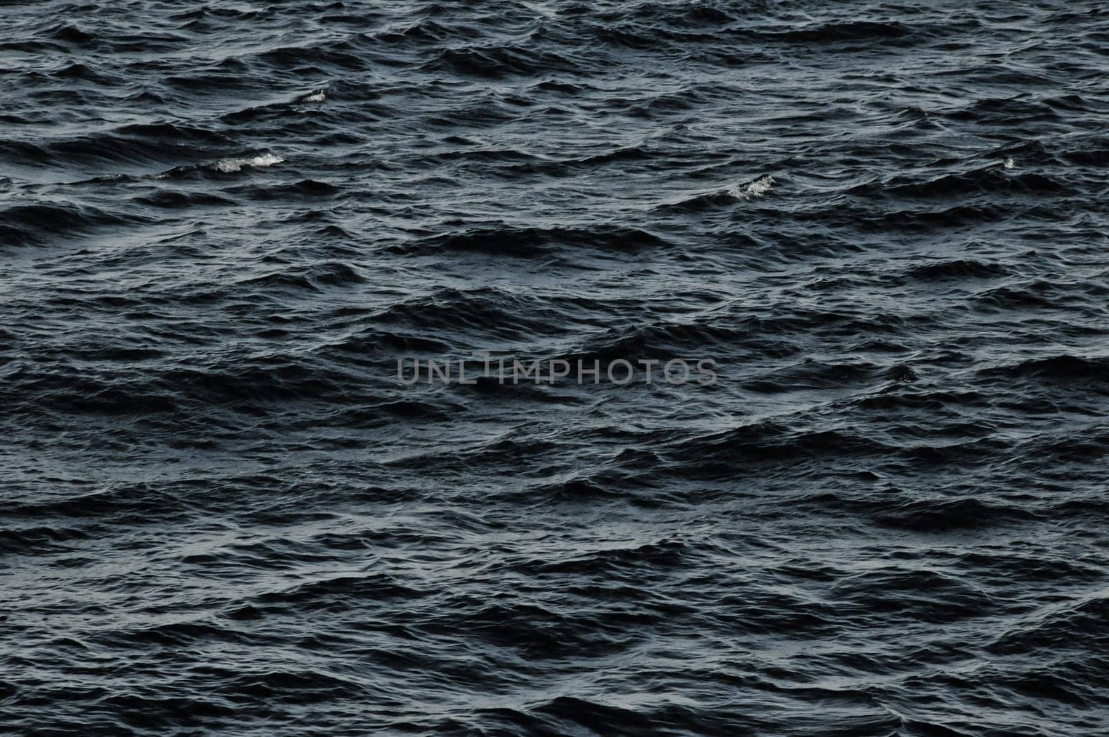 Blue Still Sea Water With Ripple. Natural Background Photo Texture