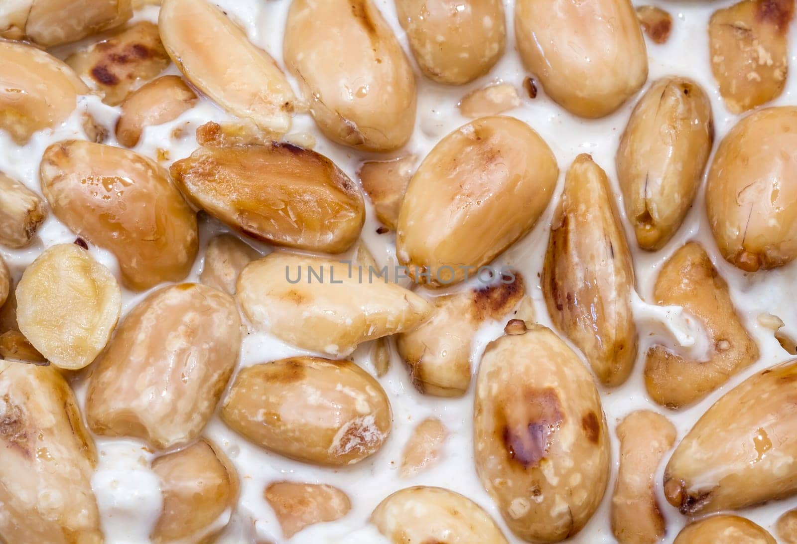 Nougat with almonds on the white