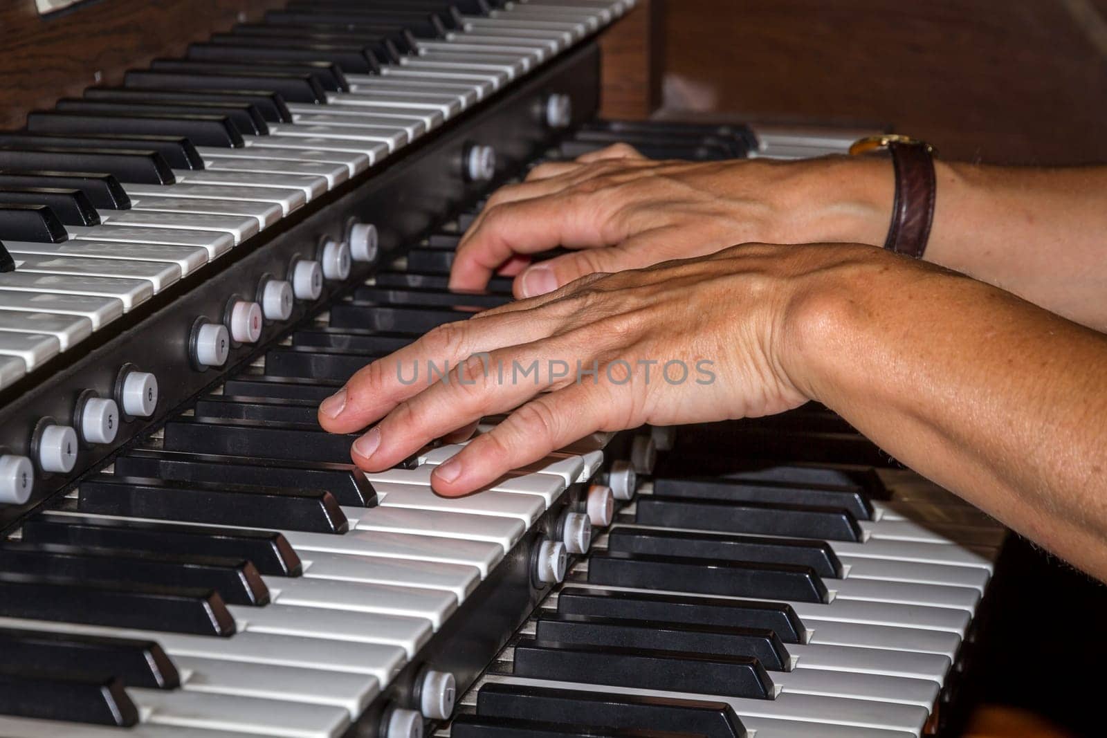 Musician playing on keyboards.