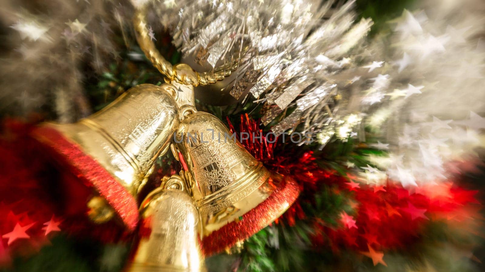 Christmas tree decoration with, bells, garland, tinsel and christmas ball