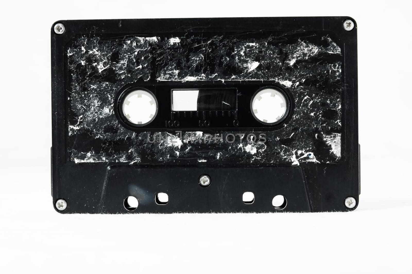 Ancient Vintage Used Musicassette over a White Background