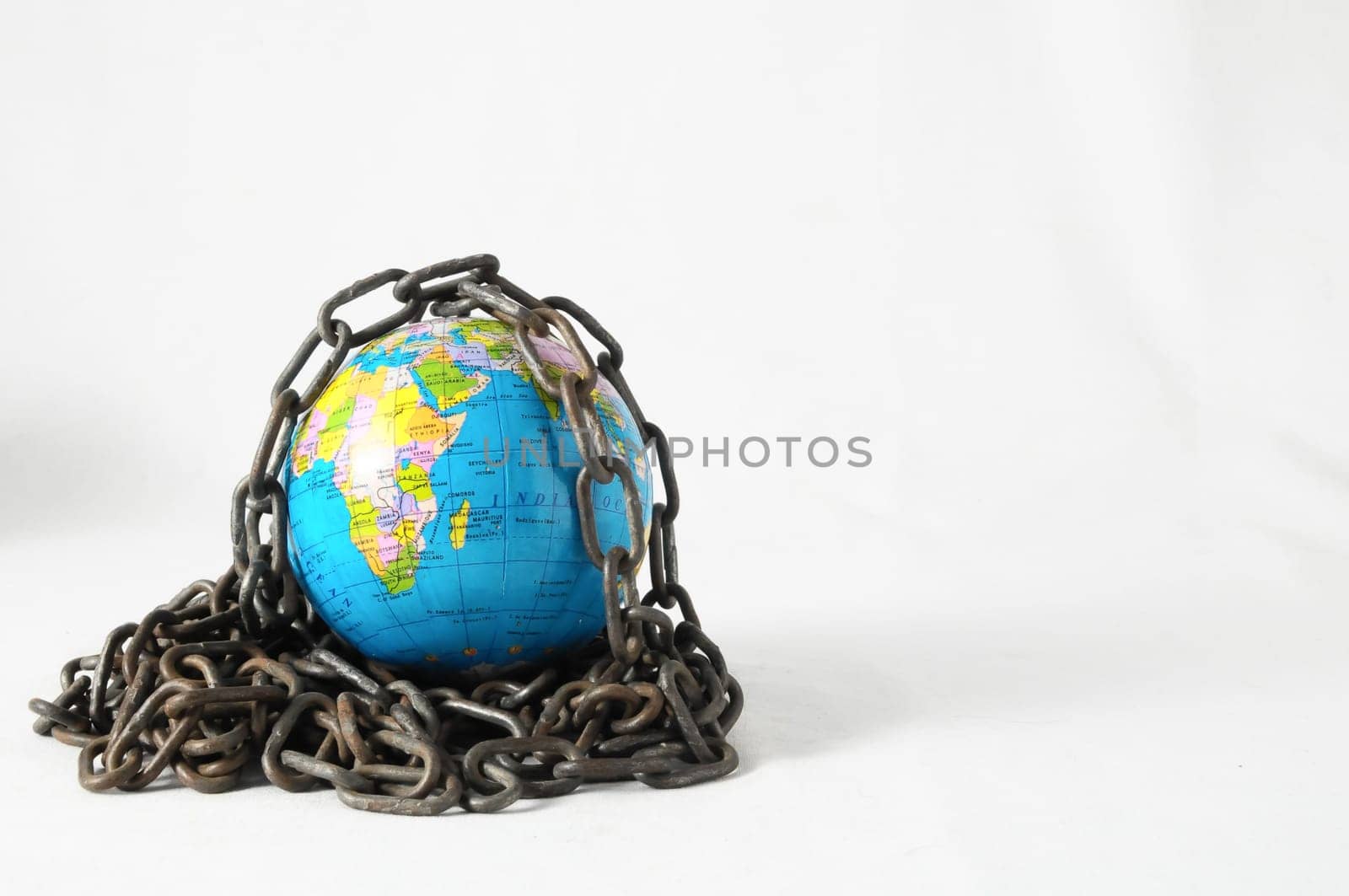 Earth globe close in chain and padlock