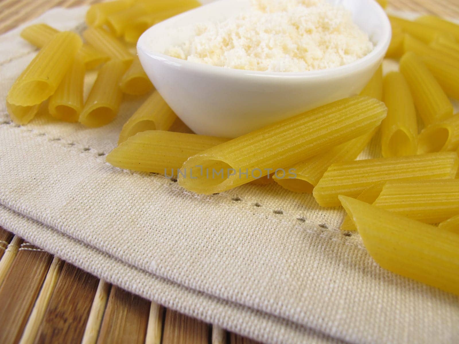 Gluten-free penne noodles and grater cheese