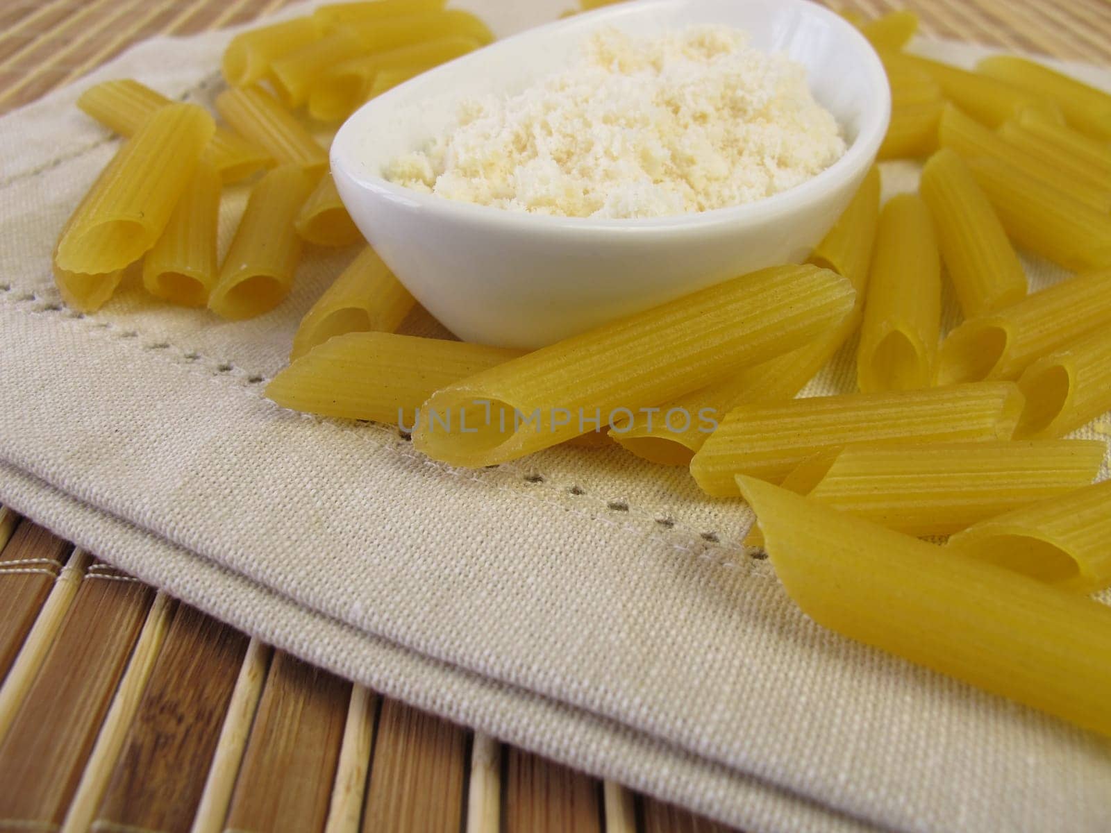 Gluten-free penne noodles and grater cheese