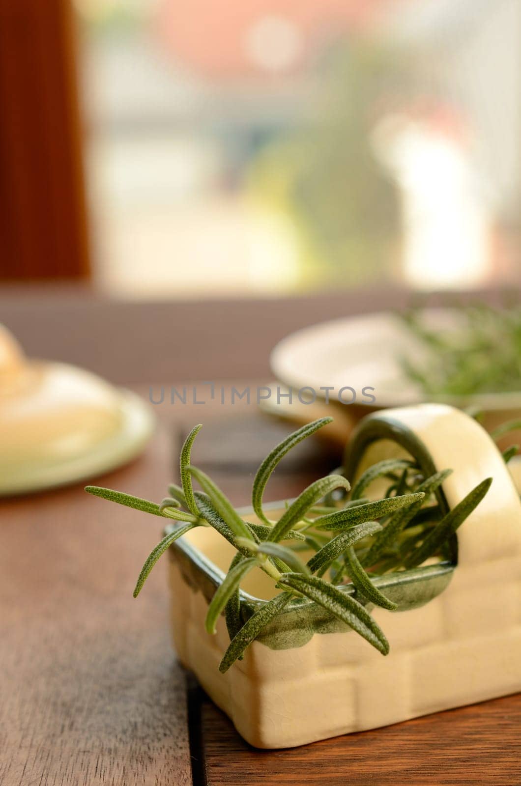 Twig of rosemary on a kitchen table